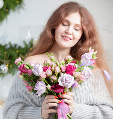 Beautiful woman with a bouquet. Ordinary woman with flowers