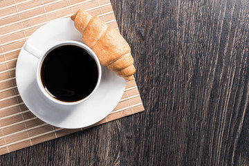 Cup of espresso coffee on wooden table