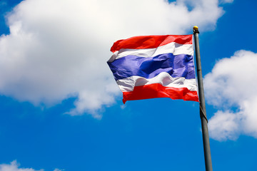Image of waving Thai flag of Thailand with blue sky background
