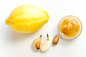 Lemon, honey and garlic on a white background. Immunity strengthening and virus protection