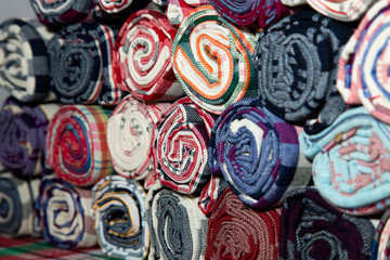 Pile of Loincloth fabric Thailand silk. Thai loincloth roll for sale at the market in thailand