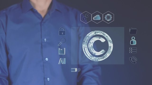 The concept of modern copyright. The technology of digital intellectual property. Loading information security. Futuristic monitor and man of the future. Authorship in the Internet cyber space.