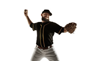 Baseball player, pitcher in a black uniform practicing and training isolated on a white background. Young professional sportsman in action and motion. Healthy lifestyle, sport, movement concept.
