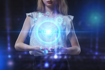 Business, Technology, Internet and network concept. Young businessman working on a virtual screen of the future and sees the inscription: Introduction