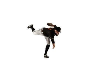 Baseball player, pitcher in a black uniform practicing and training isolated on a white background....