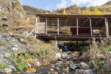 The extension  to the house stands above the bed of a mountain river in Svaneti in the highlands of Georgia