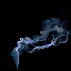 Fototapeta premium Blue smoke on black background
