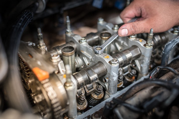 Fototapeta na wymiar Valve clearance adjustment of automobile engine