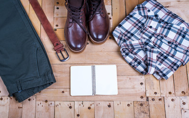 men's stylish winter clothes and Blank white notebook . winter fashion