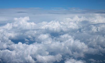 Naklejka na ściany i meble Blue sky and clouds, View from window of airplane.