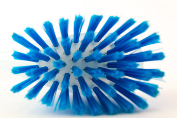 Blue plastic brush for dish isolated on white background. Equipment for cleaning