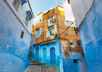 Chefchaouen city street with blue walls and beautiful windows in Morocco