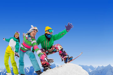 frieds  snowboarders on ski resort