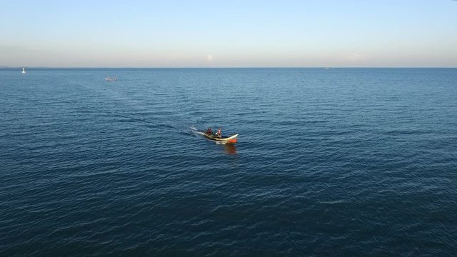 Bird's-eye view, Local fishing boats are sailing in the middle of the sea to find fish in the morning. At Patani sea, Thailand.