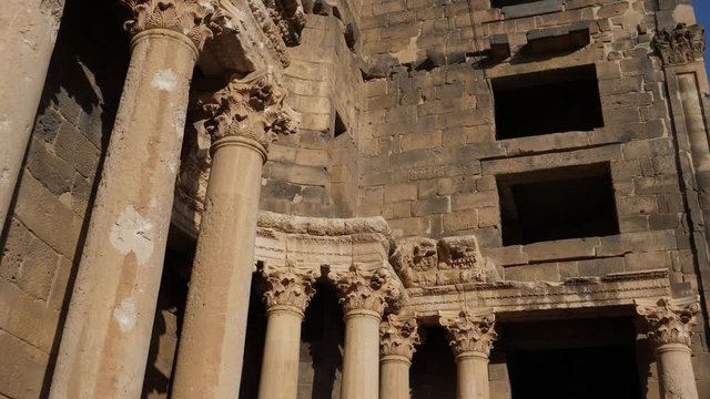 Still shot of the ancient Bosra Amphitheatre with thick walls and columns.