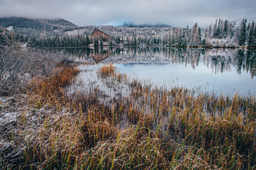 Lake in mountains between autumn and winter, original wallpaper