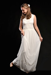 Fototapeta na wymiar Beautiful blonde teen girl in white dress