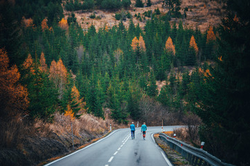 Group training, athletes walking together on the road while autumn training