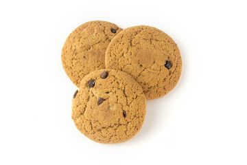 Three oatmeal cookies with chocolate chips on a white background view from the top.
