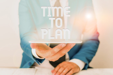 Text sign showing Time To Plan. Business photo text Preparation of things Getting Ready Think other solutions Businessman in blue suite with a tie holds lap top in hands