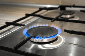 Gas flame stove on the home steel kitchen, cook
