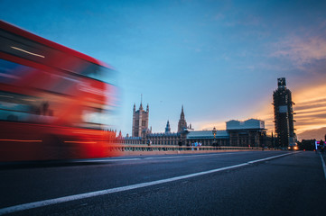 Iconic red double decker on Westminster Bridge front of House of parliament and Big Ben in London