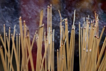 Smoke from many incense sticks that burning and embroidered in incense burner, Buddhists pray to be happy in the new year and ward off bad luck.