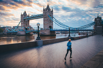 Running in London. Man train near by Tower Bridge, London, England,
