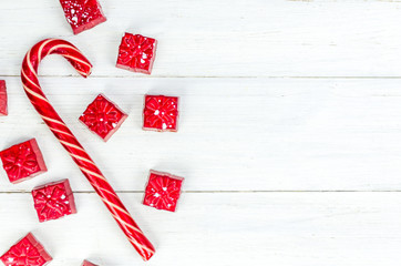 Naklejka premium Christmas. New Year's Eve. Background. red candy in the form of gifts on a white background