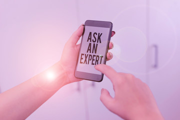 Word writing text Ask An Expert. Business photo showcasing Superior Reliable Ace Virtuoso Curapp storeity Authority Geek woman using smartphone office supplies technological devices inside home