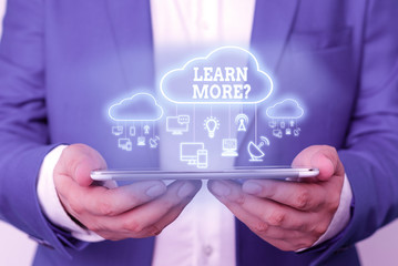 Text sign showing Learn More question. Business photo text gain knowledge or skill studying practicing
