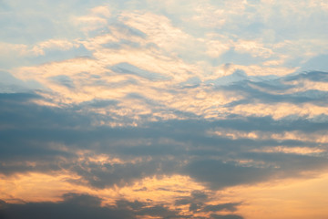 Naklejka na ściany i meble Clouds at sunset before rain blue orange and dark sky
