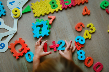 little girl learning numbers and math, education concept