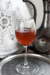 Iced Rosehip Drink. Light Metal Background.