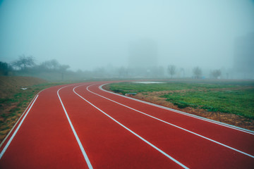 Athlete Track or Running Track with blue misty background. White edit space