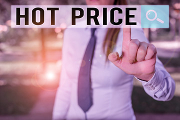 Writing note showing Hot Price. Business concept for Buyer or seller can obtain something for a product sold or buy Handsome business girl pointing with finger into empty space