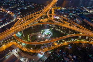 Fototapeta na wymiar Aerial view of Bhumibol suspension bridge cross over Chao Phraya River in Bangkok city with car on the bridge at sunset sky and clouds in Bangkok Thailand.