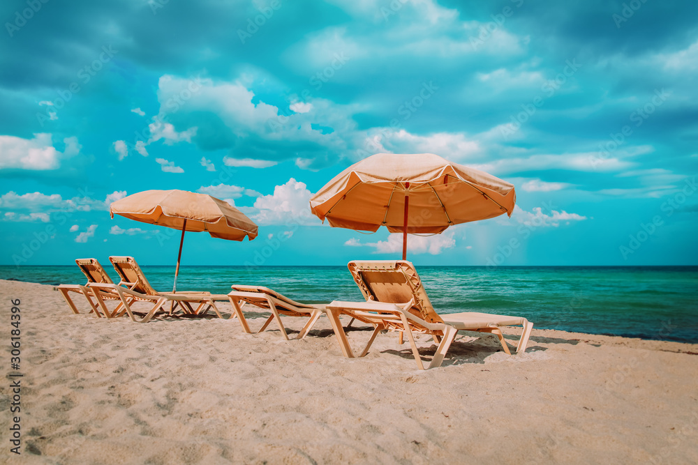 Wall mural Beach chairs on tropical vacation, travel to sea concept