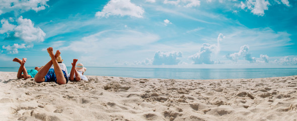 father with son and daughter relax on beach vacation, panorama