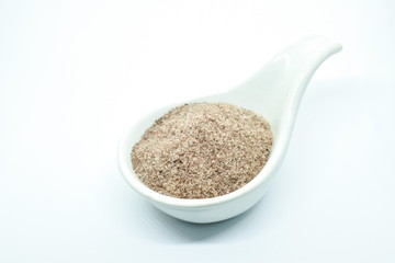Himalayan black salt or volcanic rock salt on spoon in white background