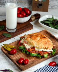 spicy chicken doner on a wooden plank