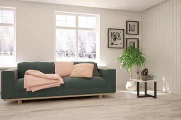 Stylish room in white color with green sofa and winter background in window. Scandinavian interior design. 3D illustration