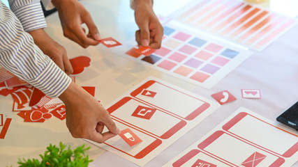 Ux Ui concept, Closeup team of development software mobile working with design workspace.
