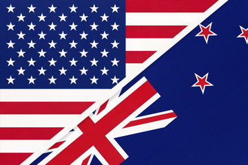 USA vs New Zealand national flag from textile. Relationship between american and Oceania countries.