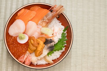 Fresh raw seafood mixed rice bowl (Kaisen-don, Japanese tasty food).