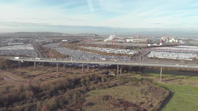 Motorway overpass & automotive factories, industrial drone shot