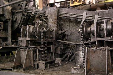 Obraz na płótnie Canvas pipes machinery and steam turbine at plant Old gears rust chain oil