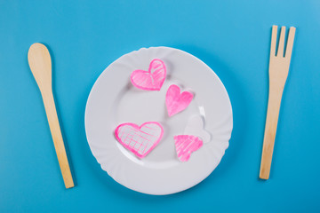 heart on a plate with fork and knife