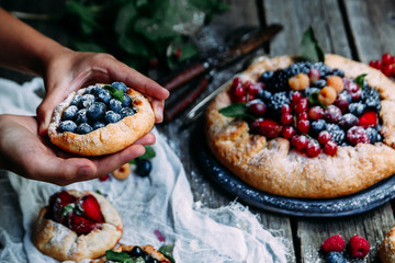 biscuit with berries of blackberry, raspberry, blueberry, black currant, strawberry