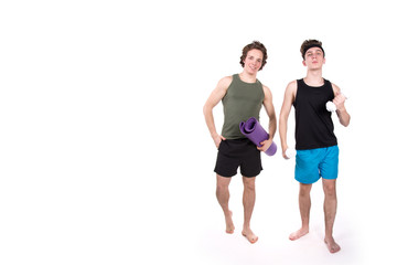 Fototapeta na wymiar Fitness and healthy lifestyle. Two funny young guys. White background.